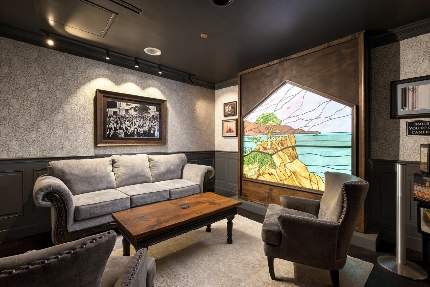 Dark paneled library lounge with expansive windows