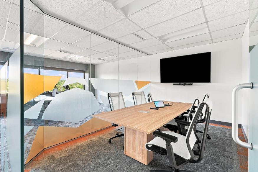 Furnished meeting room with glass walls