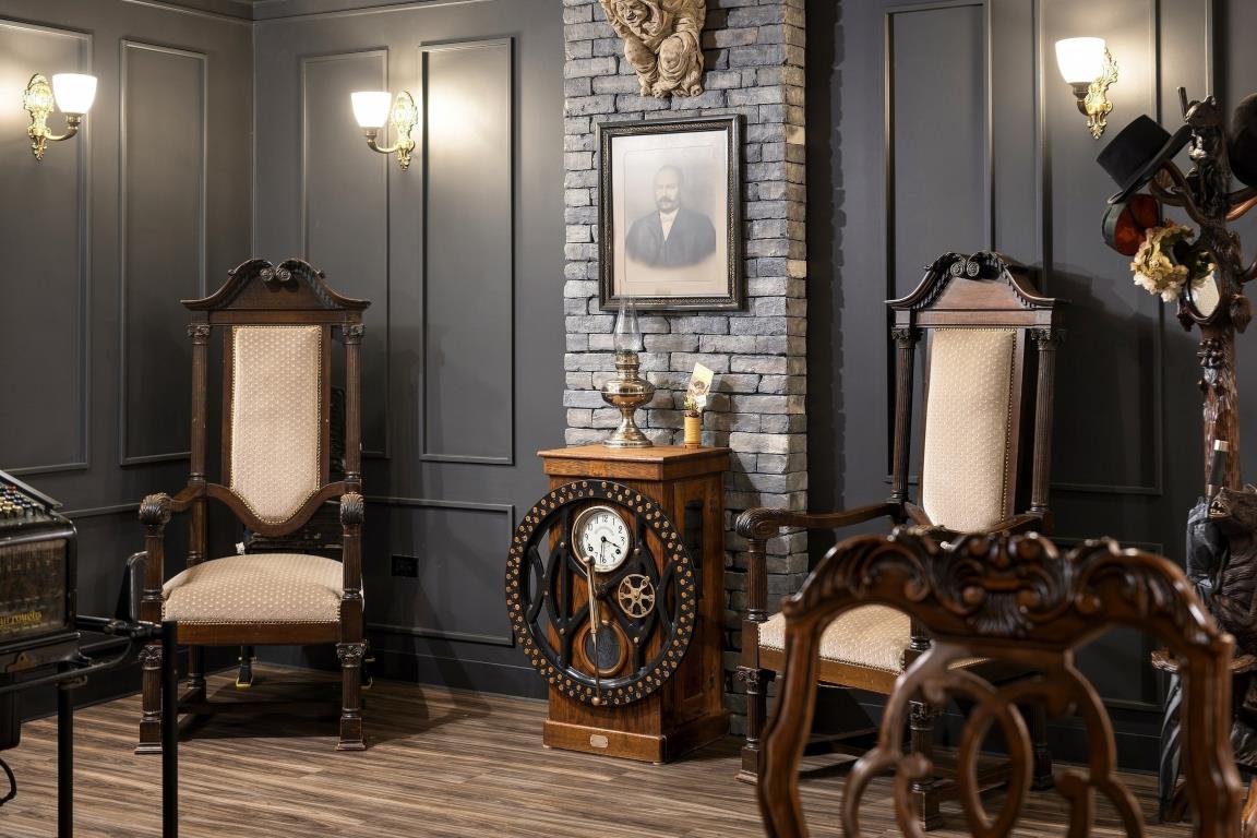 Detailed seating arrangement in a dark paneled room