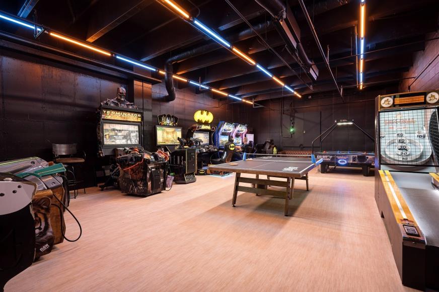 Colorful recreation room with games and seating