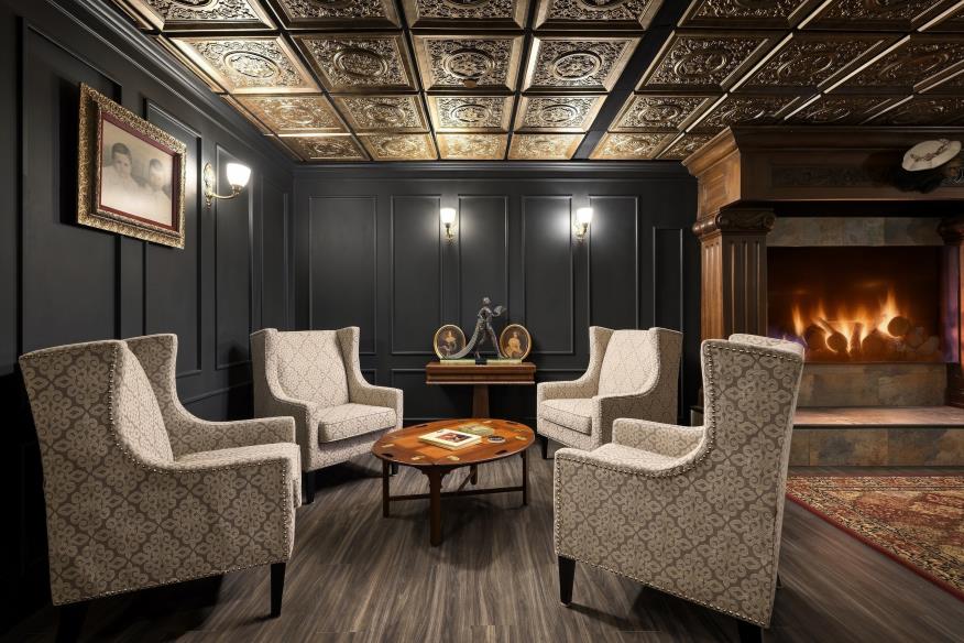 Fireside seating area with patterned ceiling