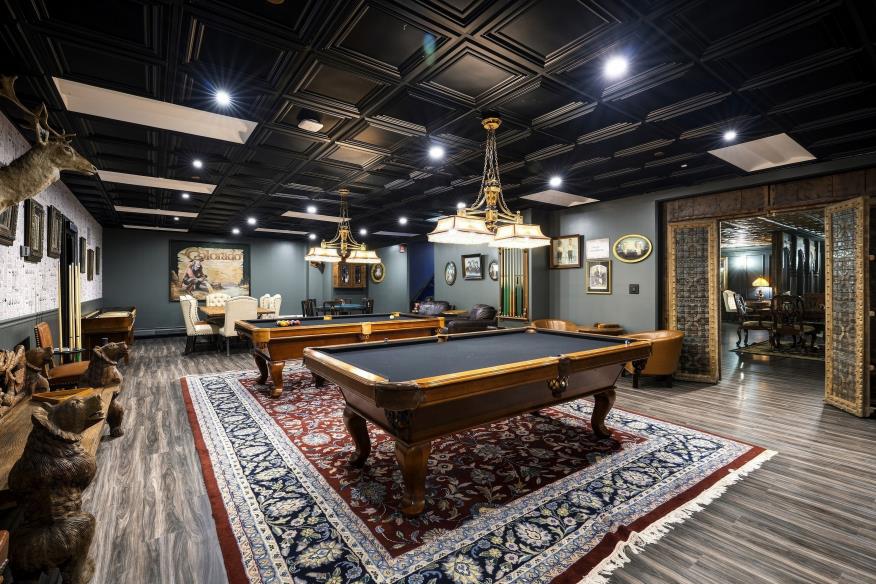 Billiards and lounge room with patterned rugs